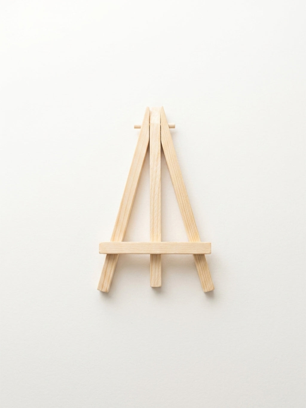 Small wooden easel on a white background