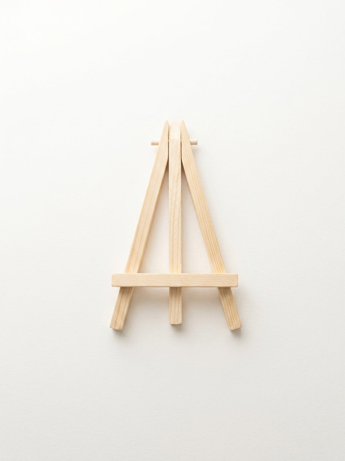 Small wooden easel on a white background