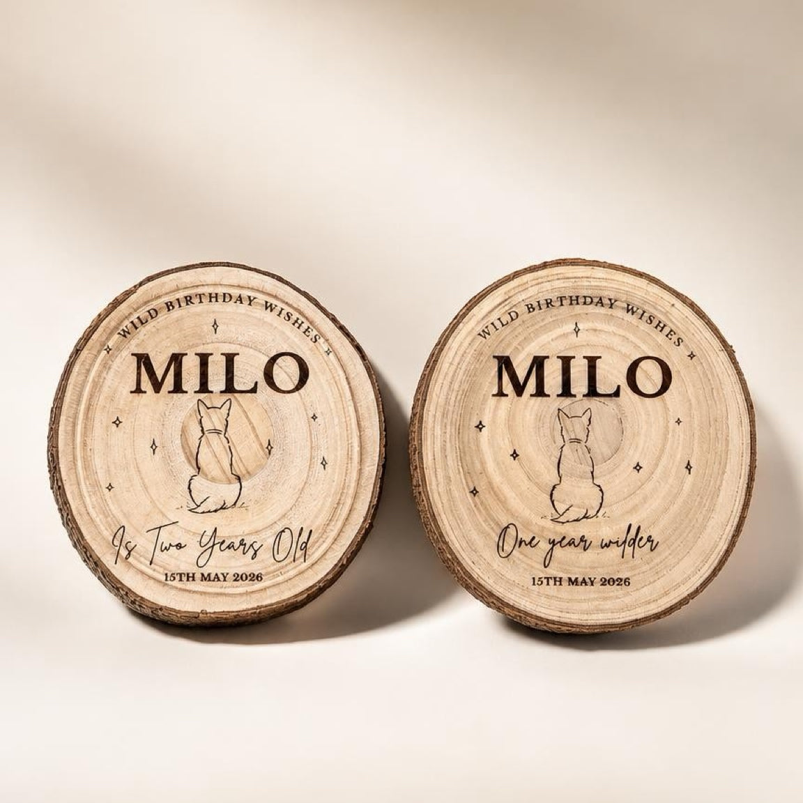Two wooden plaques with engraved text and a dog illustration on a beige background.